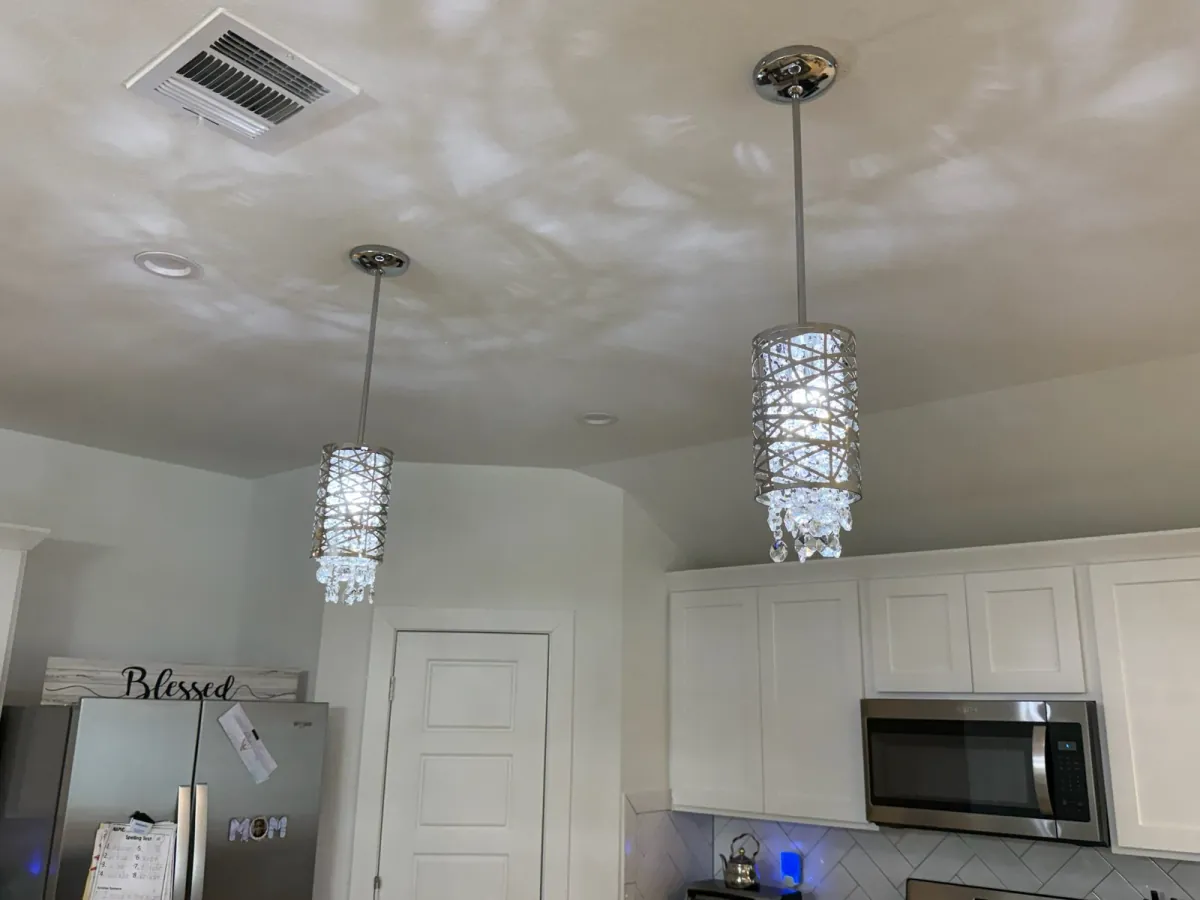 Ceiling light mounting plate prepared before chandelier installation